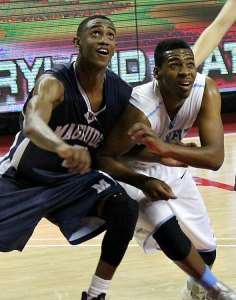 Magruder senior and George Washington University recruit Nick Griffin (left) and Eleanor Roosevelt's Lerenzo Foote battle for position during Saturday's state title game.